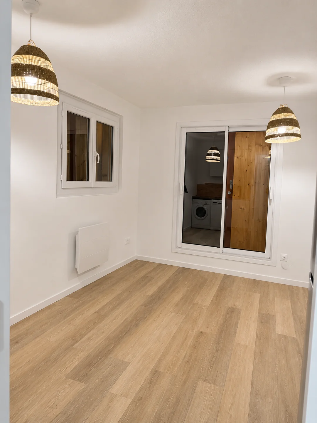 Pièce de vie et cuisine de l’appartement à Super Devolu